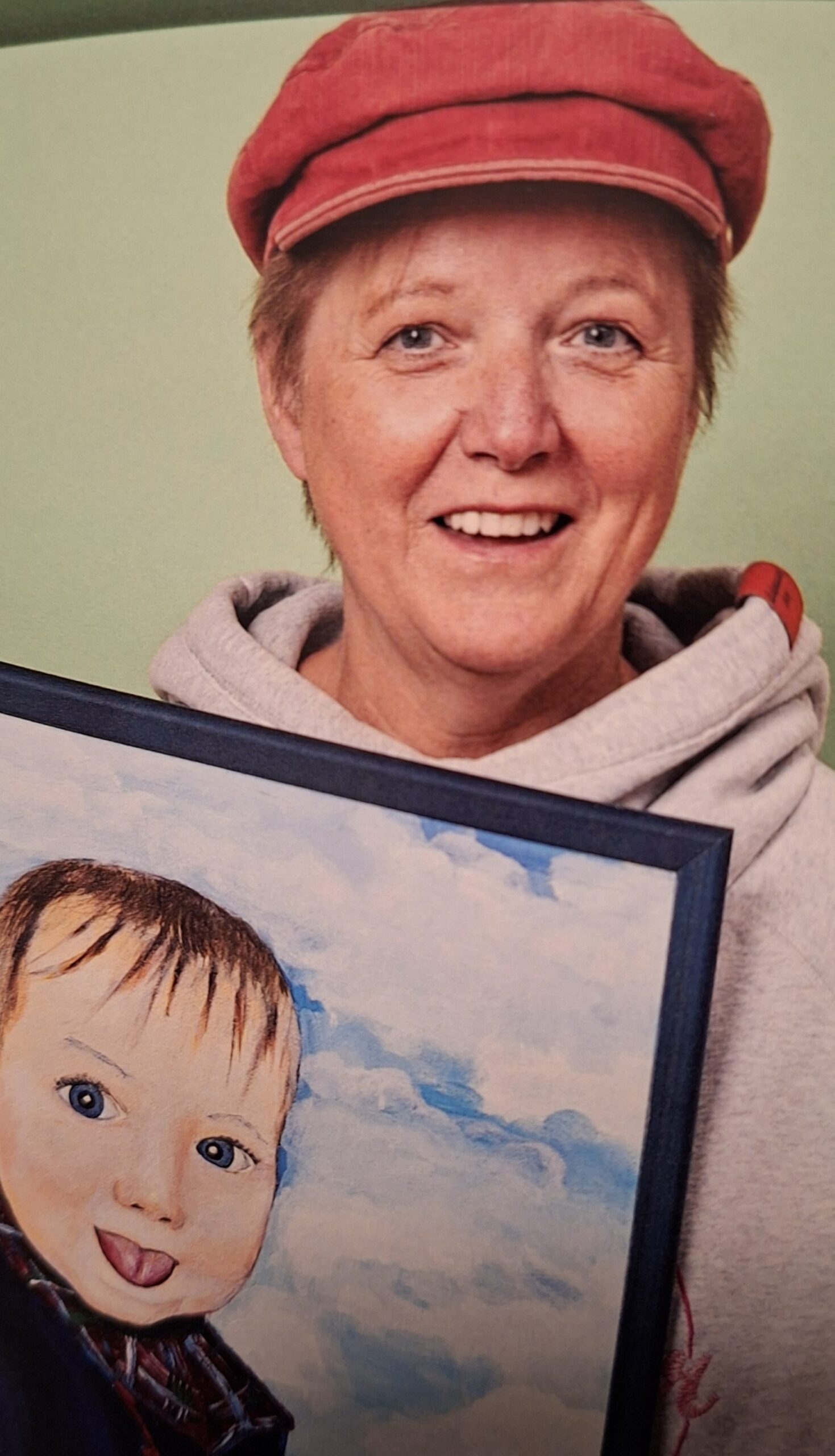 Portrait von Bettina Hellmann mit Bildausschnitt mit Kinderkopf.